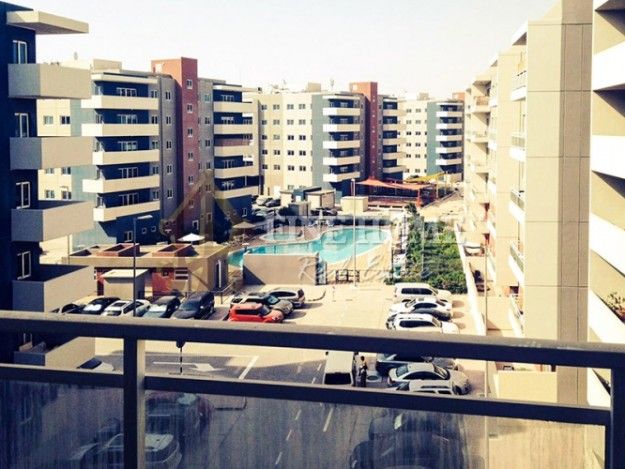 invest Now For 2 BR. Apartment Pool View in Al Reef Downtown