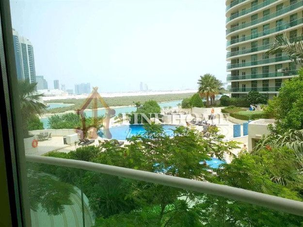 This 1BR Apartment with sea and pool view